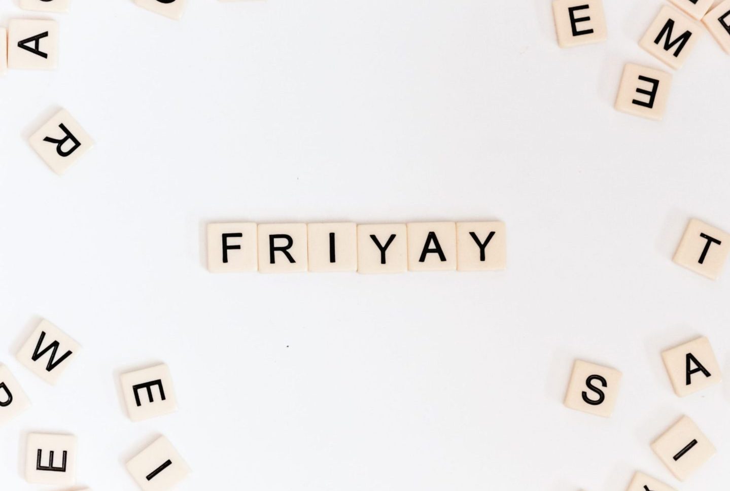 Friyay scrabble pieces on white surface